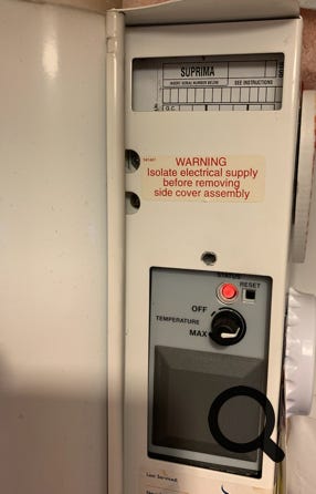 Photo of Suprima data label showing blank spaces where data should have been entered by person replacing the PCB chassis.